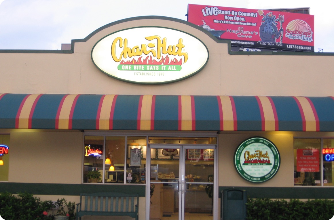 Char-Hut restaurant with the classic oval sign — One Bite Says It All